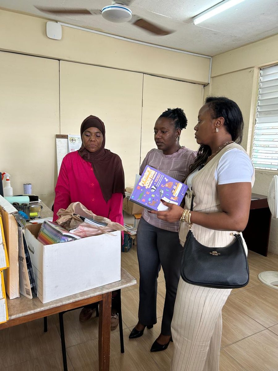 Students receiving new backpacks and school supplies during a Foundation supply drive