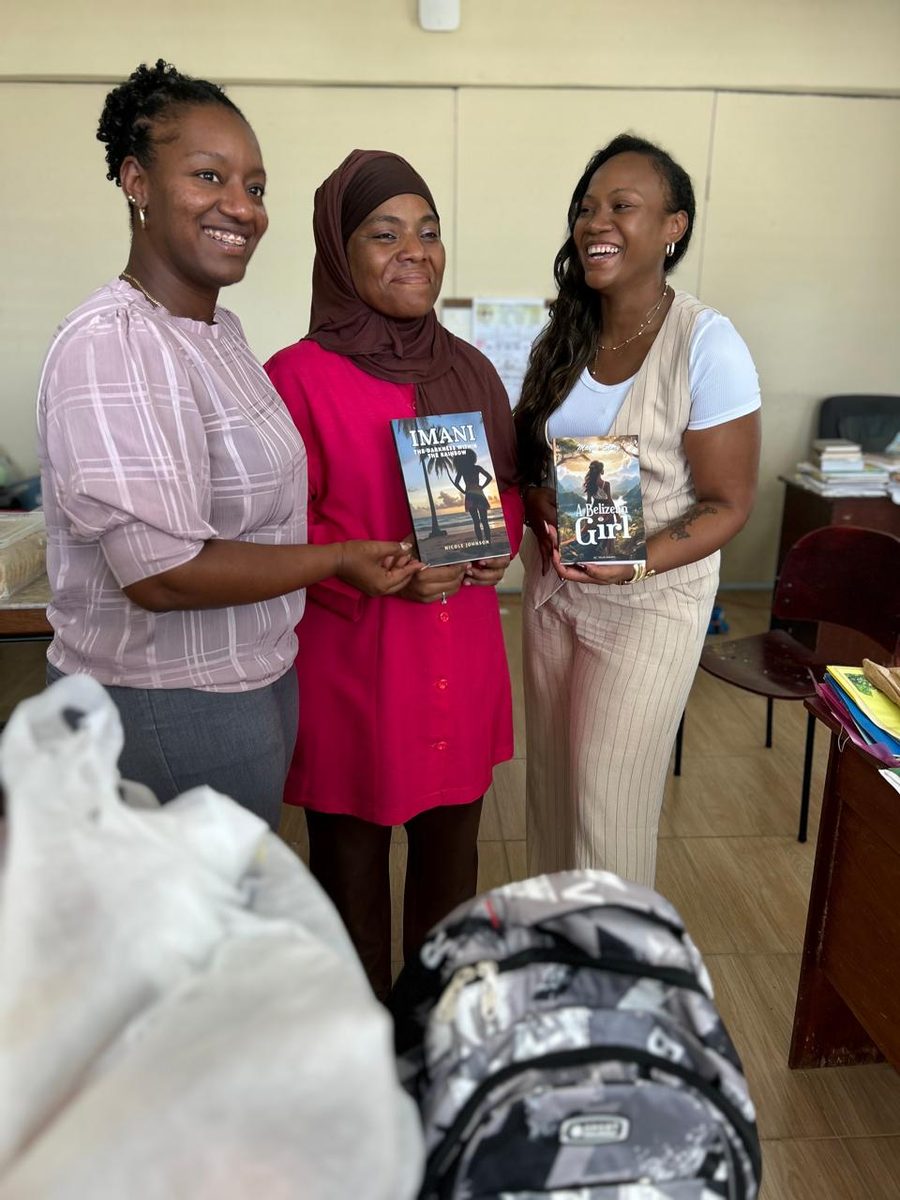 Students lined up in classroom waiting to receive school supplies and backpacks